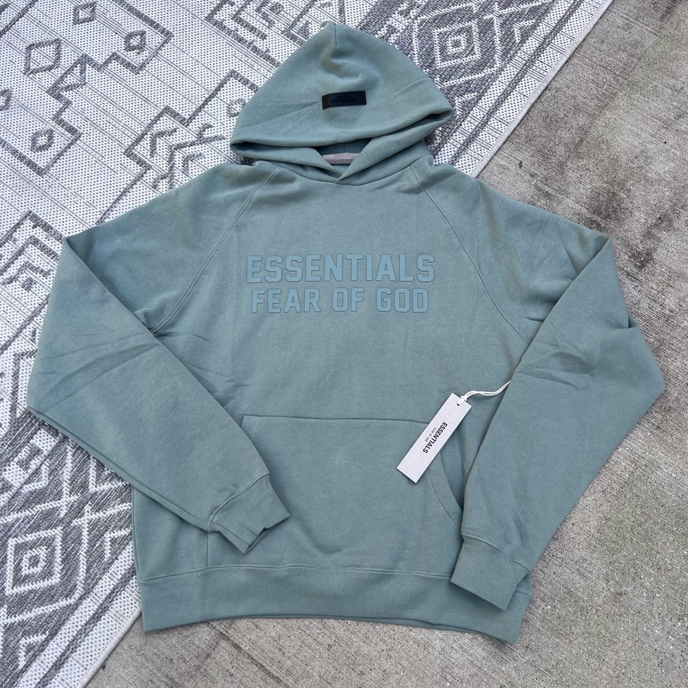 Fear of God Essentials Hoodie
Sycamore